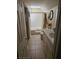 Clean bathroom with tiled floor, shower-tub combo, and white vanity at 7073 Stonecreek Dr, Douglasville, GA 30134