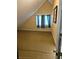 Attic bedroom with sloped ceiling, window with curtains, and carpet at 7073 Stonecreek Dr, Douglasville, GA 30134