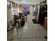 Open dining room featuring tile floors, natural light, and a table with seating for six at 7073 Stonecreek Dr, Douglasville, GA 30134