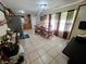 Open dining room featuring tile floors, natural light, and a table with seating for six at 7073 Stonecreek Dr, Douglasville, GA 30134