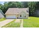 Charming single-Gathering home with a well-maintained lawn, driveway, and attached garage at 7073 Stonecreek Dr, Douglasville, GA 30134