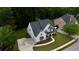 An aerial view showcases this charming two-story home with manicured lawn at 72 Hanover Dr, Villa Rica, GA 30180