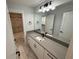 Modern bathroom with elegant vanity and tub at 72 Hanover Dr, Villa Rica, GA 30180