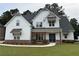 Charming two-story home featuring board and batten siding, stone accents, and a well-manicured lawn at 72 Hanover Dr, Villa Rica, GA 30180