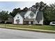 Beautiful white home with a well manicured lawn, a modern roof, and a spacious driveway at 72 Hanover Dr, Villa Rica, GA 30180