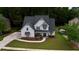 Aerial view of a charming home with manicured lawn, modern roof, and stylish curb appeal at 72 Hanover Dr, Villa Rica, GA 30180