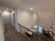 Spacious foyer with hardwood floors, iron railing, and statement chandelier at 72 Hanover Dr, Villa Rica, GA 30180