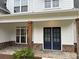 Inviting front entrance featuring double doors, stone accents, and covered porch at 72 Hanover Dr, Villa Rica, GA 30180