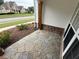 Cozy front porch with unique flagstone floor and stone facade at 72 Hanover Dr, Villa Rica, GA 30180