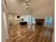 Open-concept living room with fireplace, hardwood floors, and modern lighting at 72 Hanover Dr, Villa Rica, GA 30180