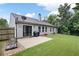 Home showcasing a well maintained backyard with a concrete patio, ideal for outdoor relaxation and entertainment at 784 Crestworth Xing, Powder Springs, GA 30127