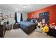 Cozy bedroom features a rustic wooden bed frame and built in shelving, creating a warm and inviting atmosphere at 784 Crestworth Xing, Powder Springs, GA 30127