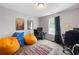 Bedroom with beanbag chairs, desk, carpet flooring, and a window for natural light at 784 Crestworth Xing, Powder Springs, GA 30127