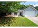 Well-kept single-Gathering home with a two-car garage and stone accents, set on a neatly trimmed lawn at 784 Crestworth Xing, Powder Springs, GA 30127
