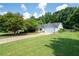 Well-maintained single-Gathering home with a long driveway and a manicured lawn at 784 Crestworth Xing, Powder Springs, GA 30127