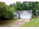 Attractive home featuring a manicured lawn and a two car garage, enhancing its curb appeal and functionality at 784 Crestworth Xing, Powder Springs, GA 30127