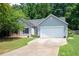 Charming single-story home with gray siding, a paved driveway and a well-maintained lawn at 784 Crestworth Xing, Powder Springs, GA 30127