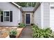 Close up of front door and walkway featuring landscaping at 784 Crestworth Xing, Powder Springs, GA 30127