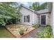 Landscaped front yard with stone accents and a charming walkway to the front door at 784 Crestworth Xing, Powder Springs, GA 30127