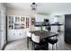Well-lit kitchen and breakfast area with sleek stainless steel appliances and pantry at 784 Crestworth Xing, Powder Springs, GA 30127