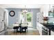 Charming kitchen nook featuring a breakfast table, French doors, and views to the backyard at 784 Crestworth Xing, Powder Springs, GA 30127