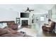 Spacious living room features hardwood floors, ceiling fan, fireplace, and comfortable seating at 784 Crestworth Xing, Powder Springs, GA 30127