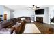 Well lit living room with fireplace and hardwood floors at 784 Crestworth Xing, Powder Springs, GA 30127