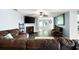 Spacious living room with a fireplace, ceiling fan, and hardwood floors at 784 Crestworth Xing, Powder Springs, GA 30127