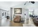 Inviting living room featuring an open floor plan, hardwood floors, and natural light at 784 Crestworth Xing, Powder Springs, GA 30127