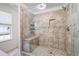 Walk-in tiled shower with a glass door and integrated bench seating, featuring an adjacent window for natural light at 784 Crestworth Xing, Powder Springs, GA 30127