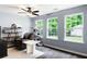 Bright sitting area with natural light, a cat tree, and a comfortable brown recliner chair at 784 Crestworth Xing, Powder Springs, GA 30127