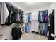 Walk-in closet with shelves and hanging storage for organization and convenience at 784 Crestworth Xing, Powder Springs, GA 30127