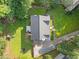 Aerial view of the home's roof, backyard, patio, swing set, and long driveway at 150 Kensley Way, Dallas, GA 30157