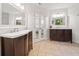 This is a large bathroom with double vanities and a connecting door to the main bedroom at 150 Kensley Way, Dallas, GA 30157