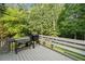 Spacious deck with a grill and bench seating, perfect for outdoor entertaining at 150 Kensley Way, Dallas, GA 30157
