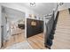 Inviting entryway featuring a staircase, decor, storage lockers, and an archway leading to the living room at 150 Kensley Way, Dallas, GA 30157