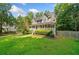 Beautiful two-story home with manicured lawn and charming front porch at 150 Kensley Way, Dallas, GA 30157
