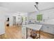 Modern kitchen with hardwood floors and an adjacent dining area at 150 Kensley Way, Dallas, GA 30157