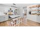 Stylish kitchen featuring modern appliances, light cabinets, and a center island at 150 Kensley Way, Dallas, GA 30157