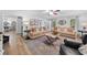 Spacious living room showcasing hardwood floors, neutral paint, multiple seating options, and ample natural light at 150 Kensley Way, Dallas, GA 30157