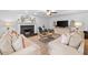 Bright living room with hardwood floors, fireplace, neutral paint, and updated decor at 150 Kensley Way, Dallas, GA 30157