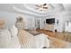 Spacious main bedroom boasts neutral decor, wood floors, and a sitting area at 150 Kensley Way, Dallas, GA 30157
