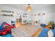 Spacious playroom with hardwood floors, a cozy rug, and bright natural light at 150 Kensley Way, Dallas, GA 30157
