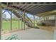 Backyard view featuring a patio with a staircase to a wooden deck and a well-maintained lawn at 4154 Hawking Dr, Suwanee, GA 30024