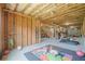 Unfinished basement with exposed ceiling, a play mat, and exercise equipment at 4154 Hawking Dr, Suwanee, GA 30024