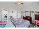 Comfortable bedroom with neutral walls, a wood dresser, and a view to an ensuite bathroom at 4154 Hawking Dr, Suwanee, GA 30024