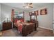 Bedroom featuring wood furniture, plush carpet, and patterned curtains at 4154 Hawking Dr, Suwanee, GA 30024