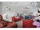 Large bedroom with a tray ceiling, decorated with plush furniture and bathed in natural light at 4154 Hawking Dr, Suwanee, GA 30024