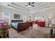 Spacious primary bedroom with a tray ceiling, multiple windows, and ample natural light at 4154 Hawking Dr, Suwanee, GA 30024