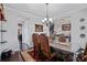 Dining room showcasing elegant decor, hardwood floors, and modern lighting at 4154 Hawking Dr, Suwanee, GA 30024